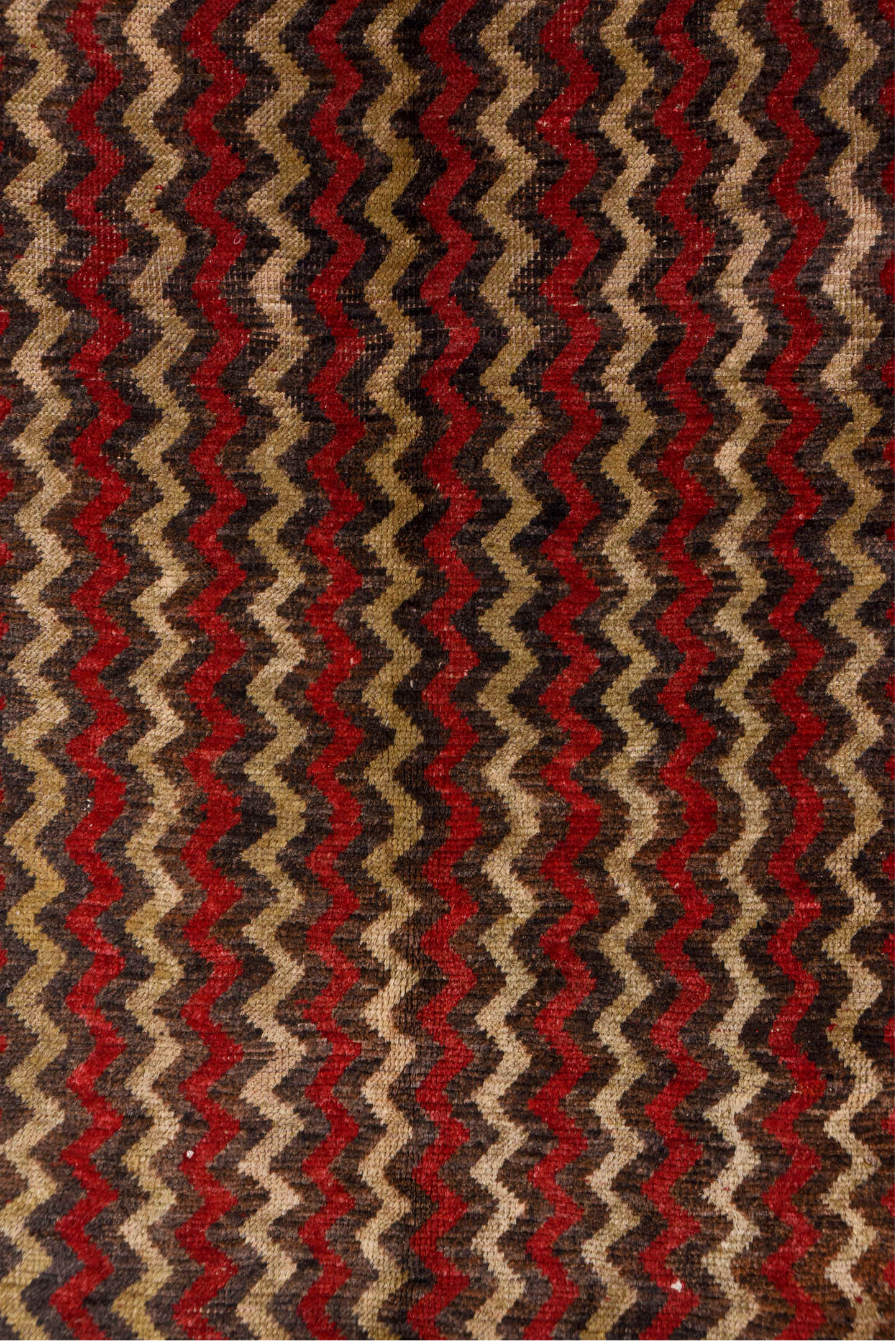 4' x 12' one-of-a-kind handmade vintage Tulu runner rug. Color palette: red, brown