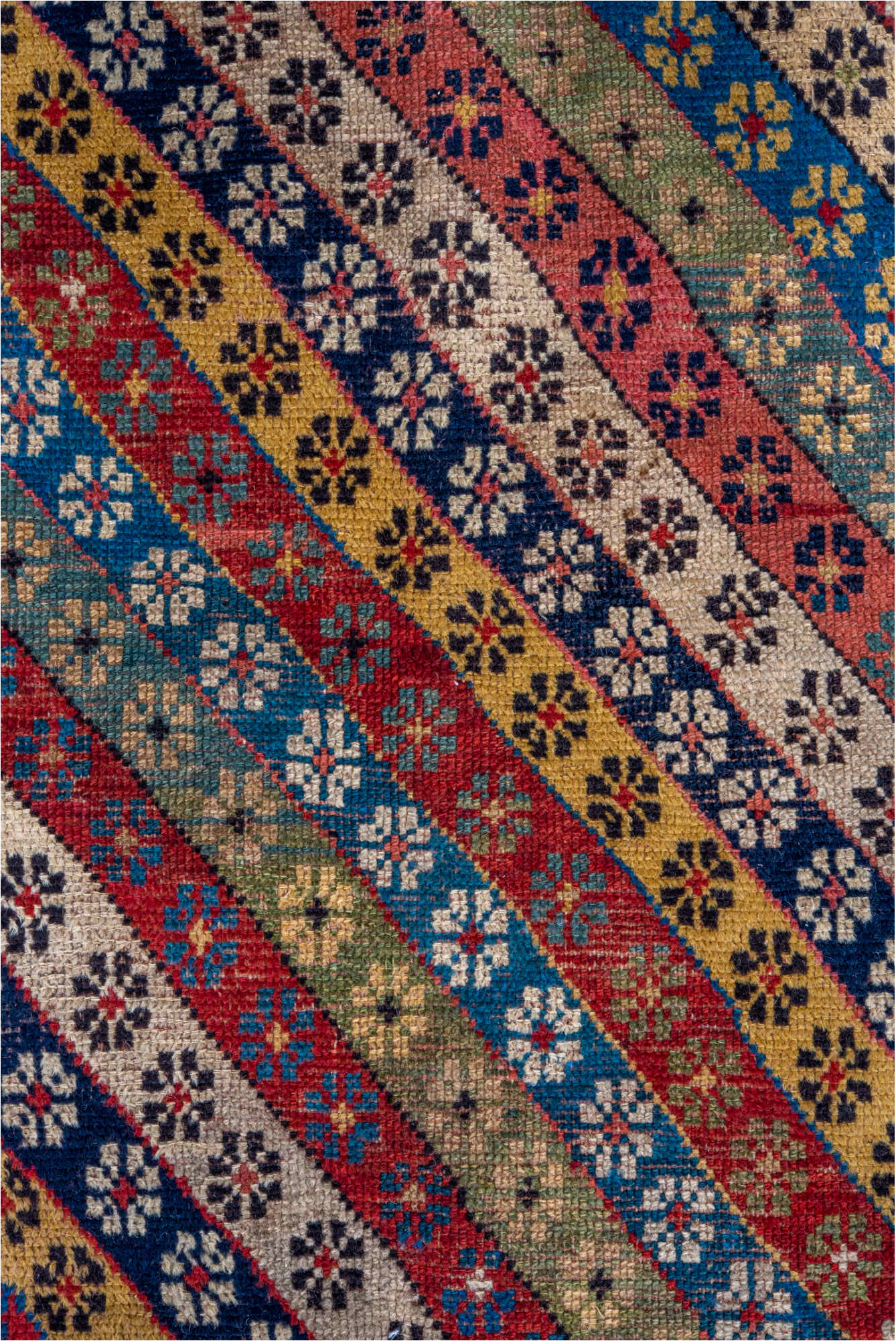 4' x 8' one-of-a-kind handmade vintage Caucasian runner rug. Color palette: black, blue, brown, gray, pink, red