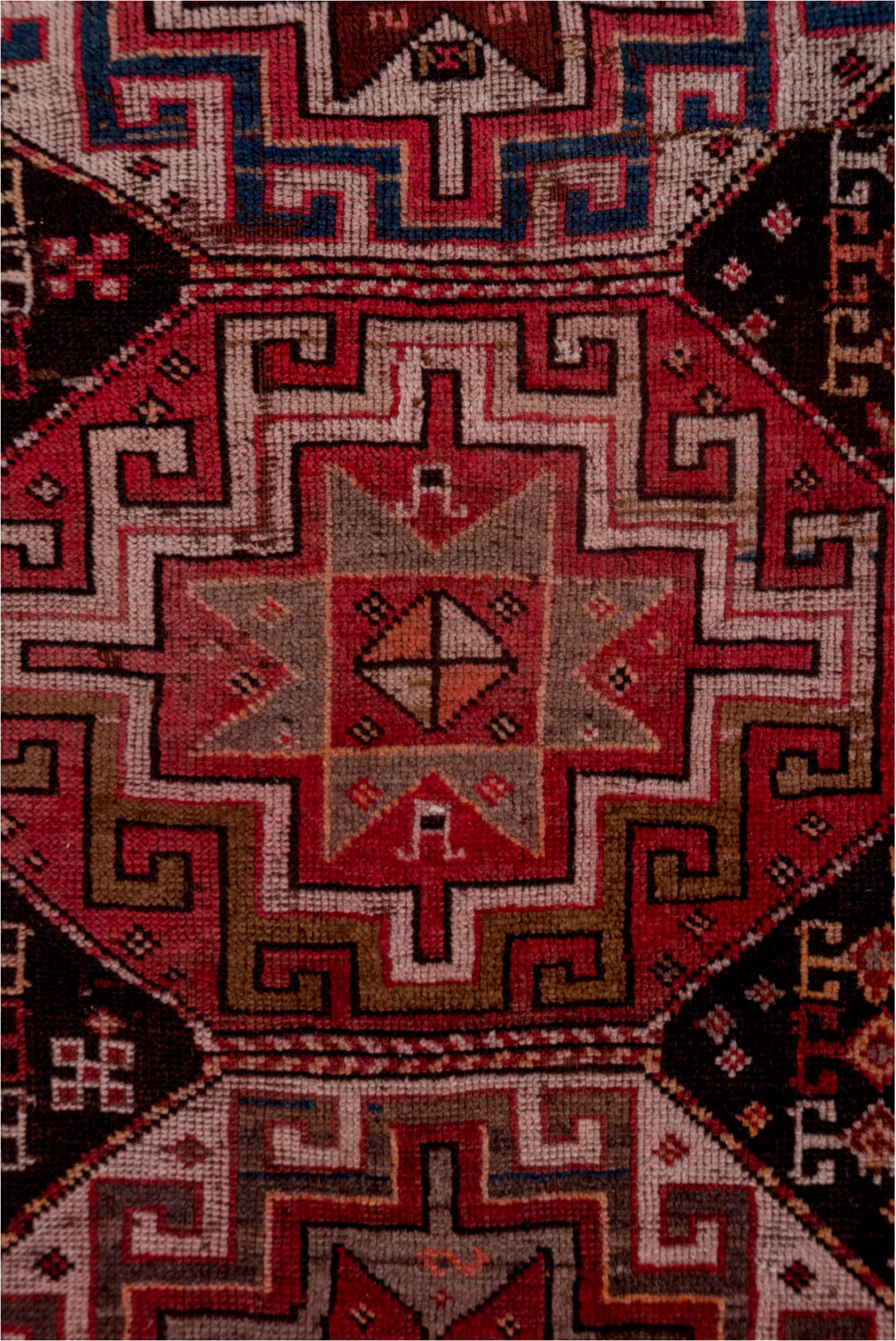 4' x 9' one-of-a-kind handmade vintage Kazak runner rug. Color palette: brown, gray, pink, red, rosy brown