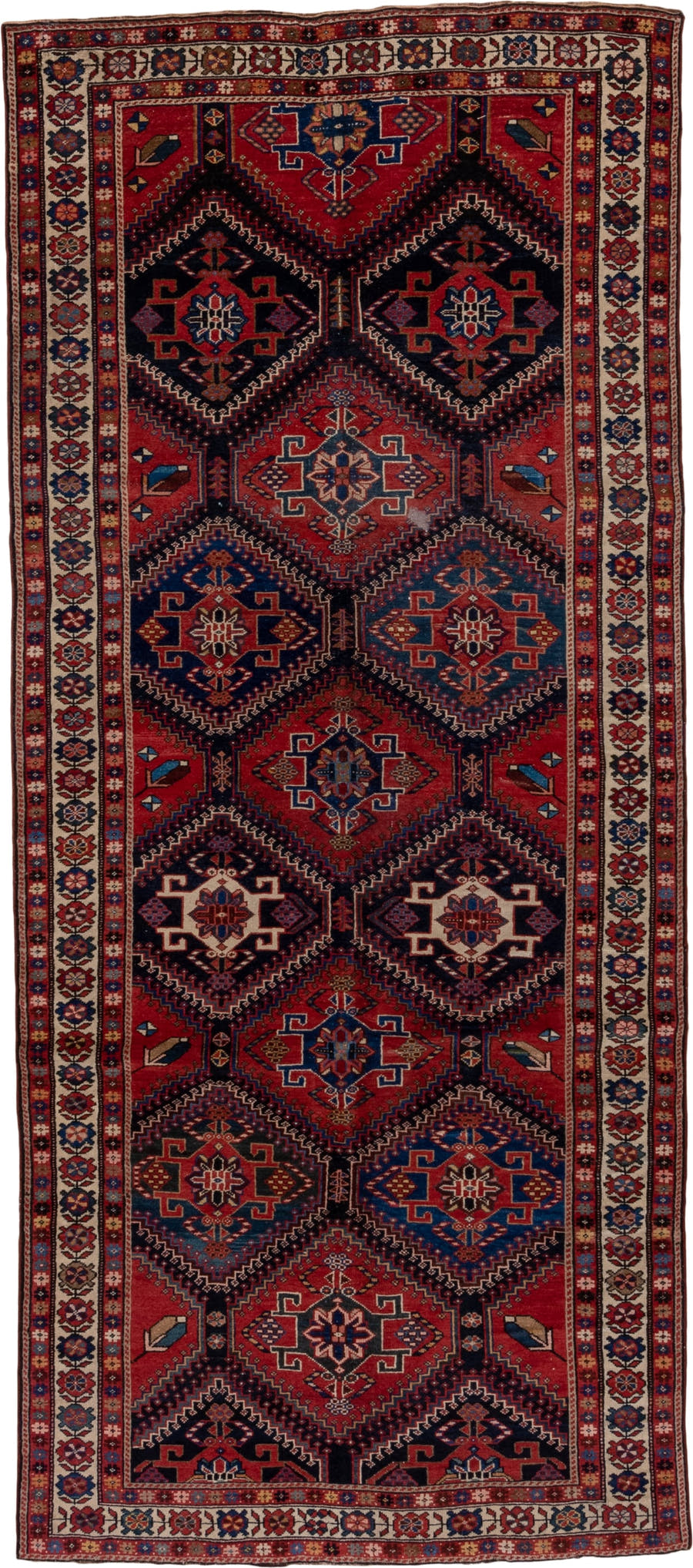 4' x 9' one-of-a-kind handmade antique Baktiary runner rug. Color palette: crimson, navy, ivory, camel, sky blue, rose