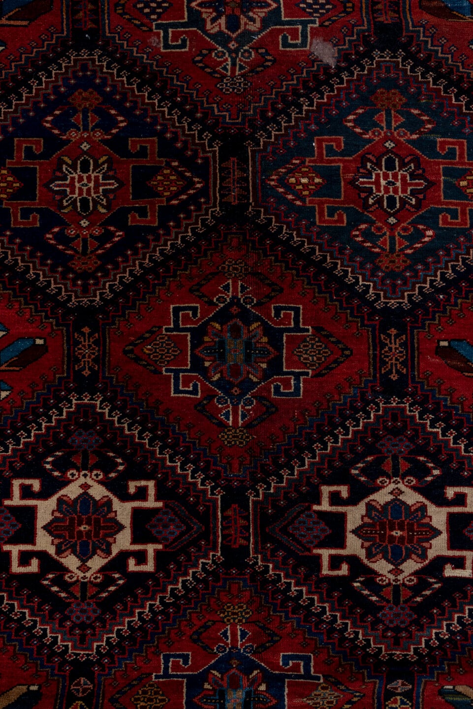 4' x 9' one-of-a-kind handmade antique Baktiary runner rug. Color palette: crimson, navy, ivory, camel, sky blue, rose