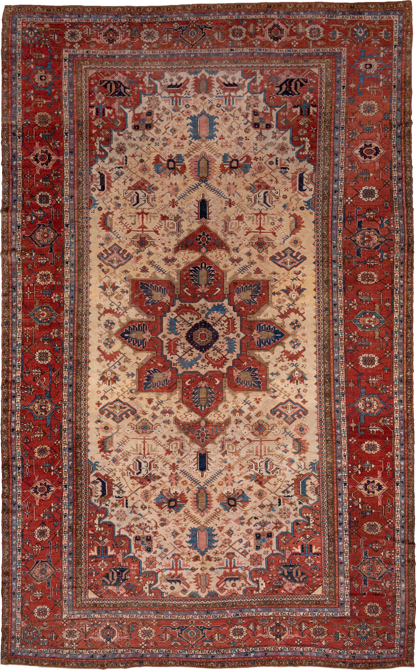 12' x 18' one-of-a-kind handmade antique Serapi oversize rug. Color palette: ivory, rust, brick red, indigo, sky blue, camel