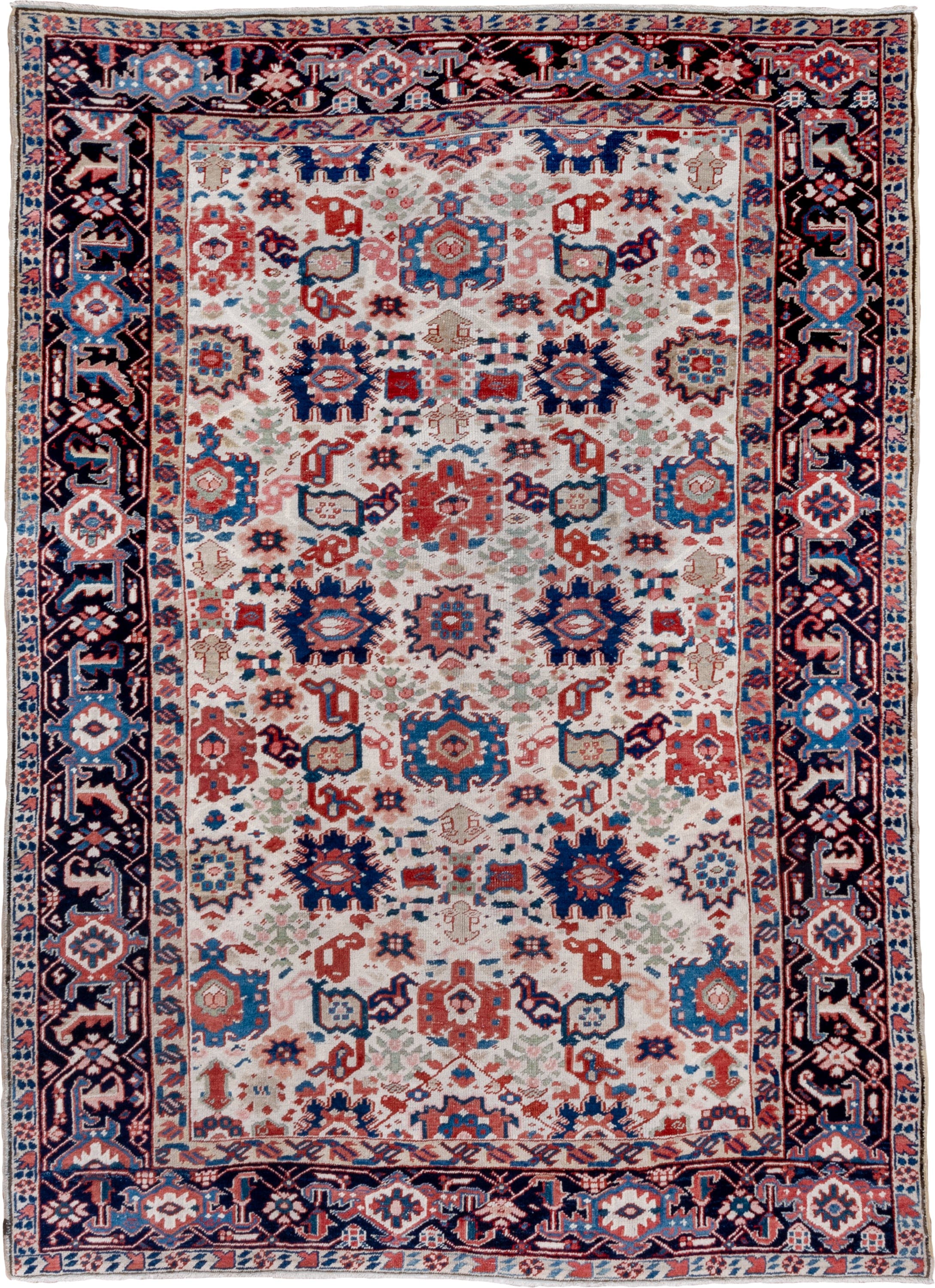 7' x 10' one-of-a-kind handmade antique Heriz large size rug. Color palette: ivory, navy, sky blue, rust, blush, crimson
