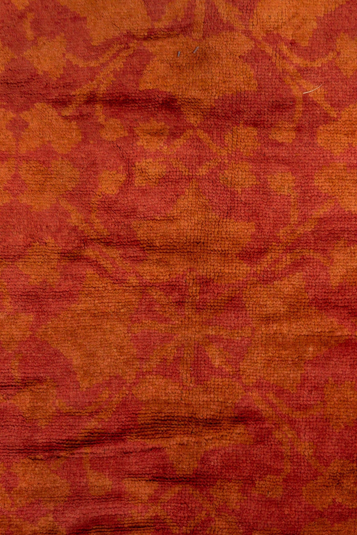 6' x 14' one-of-a-kind handmade handmade Donegal rug. Color palette: terra cotta, rust, coral, gold, slate, olive