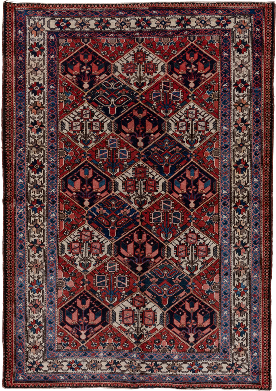 5' x 7' one-of-a-kind handmade antique Baktiary rug. Color palette: rust, ivory, navy, sky_blue, rose, charcoal, slate