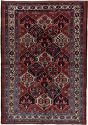5' x 7' one-of-a-kind handmade antique Baktiary rug. Color palette: rust, ivory, navy, sky_blue, rose, charcoal, slate