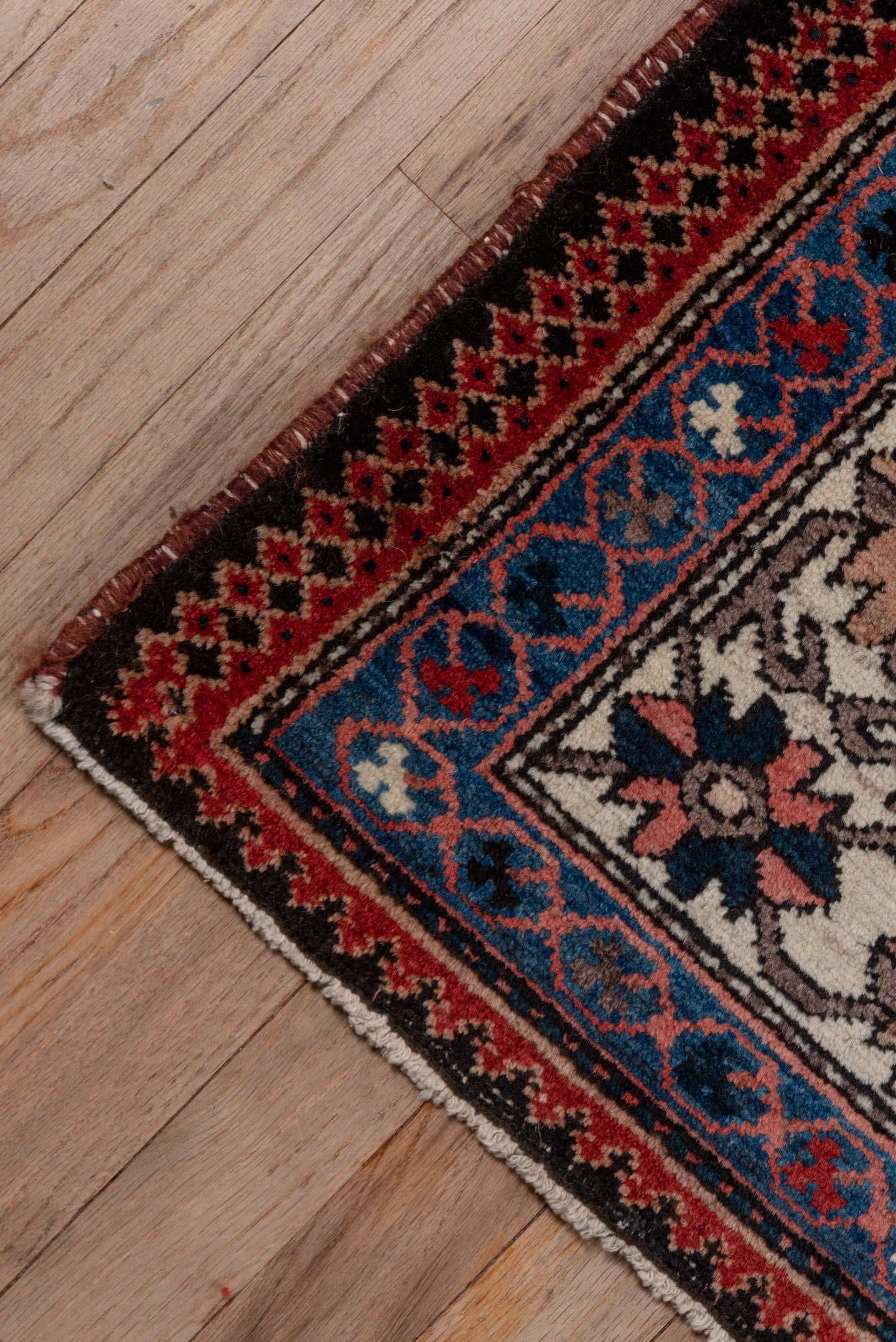 5' x 7' one-of-a-kind handmade antique Baktiary rug. Color palette: rust, ivory, navy, sky_blue, rose, charcoal, slate