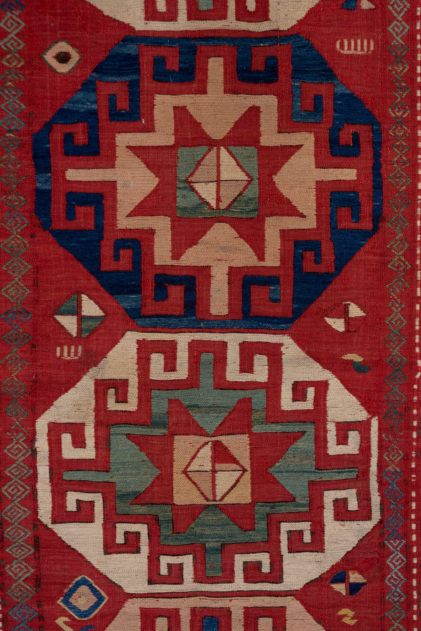 5' x 8' one-of-a-kind handmade antique Sumak medium size rug. Color palette: rust, ivory, indigo, terra cotta, sage, camel