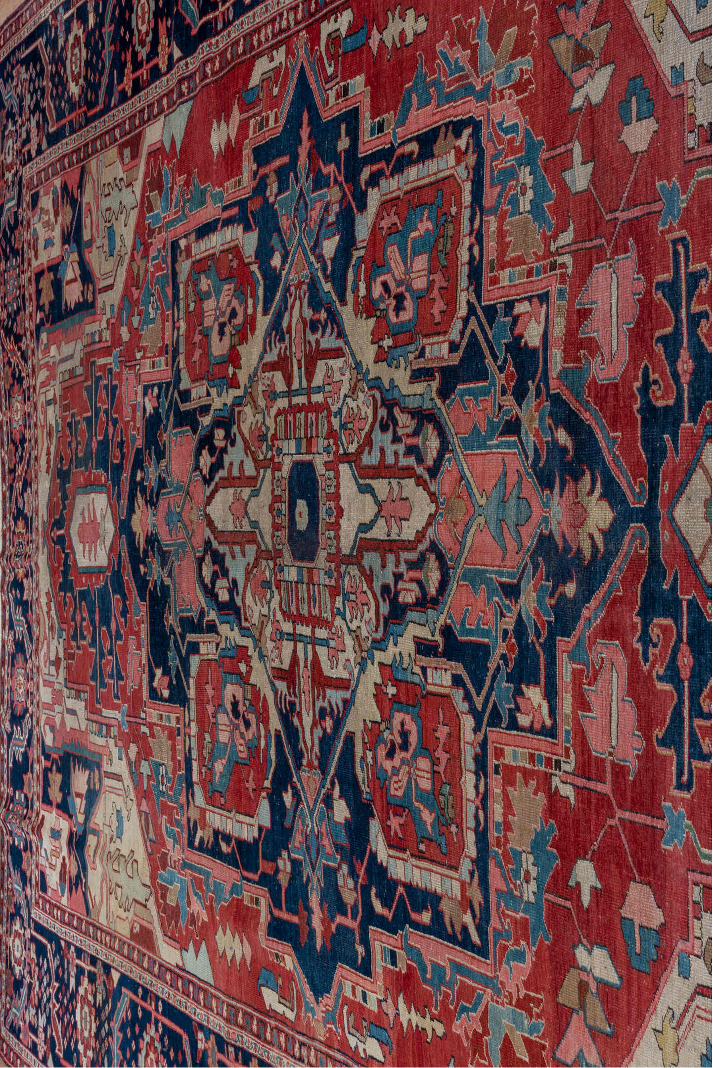 9' x 13' one-of-a-kind handmade antique Serapi large size rug. Color palette: rust, navy, ivory, sky_blue, rose, slate