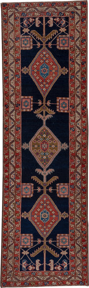 3' x 11' one-of-a-kind handmade antique Serapi runner rug. Color palette: navy, rust, ivory, camel, sky blue, rose, brown