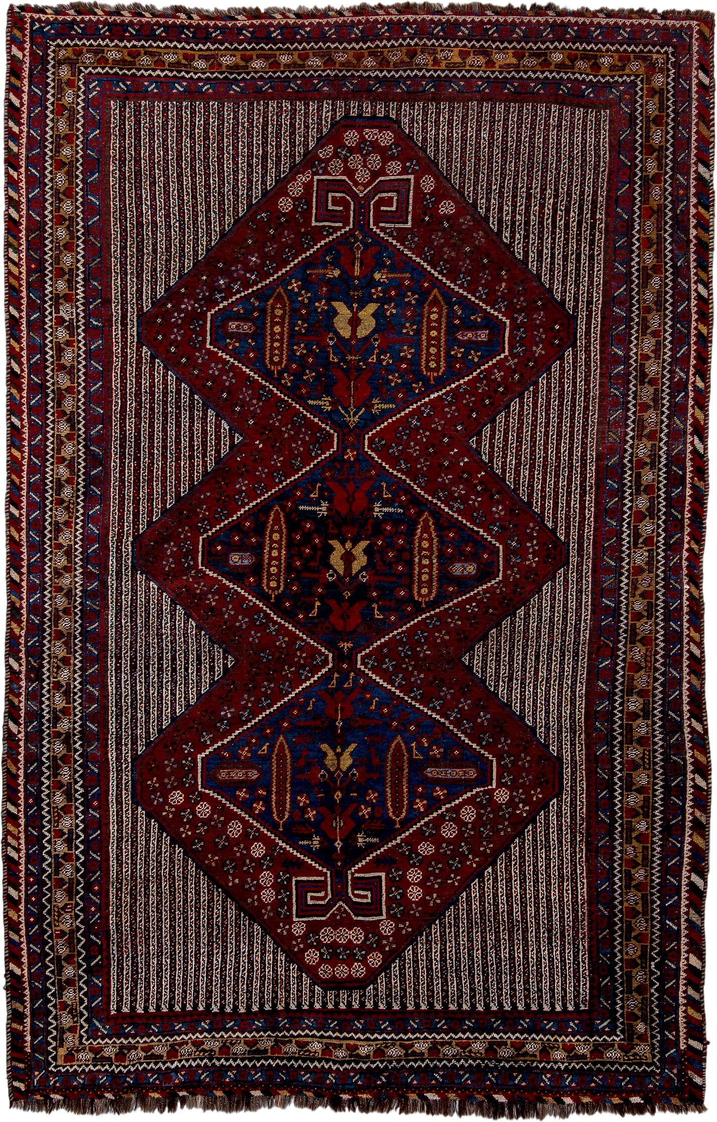 5' x 8' one-of-a-kind handmade antique Qashqai medium size rug. Color palette: rust, indigo, ivory, gold, navy, brown