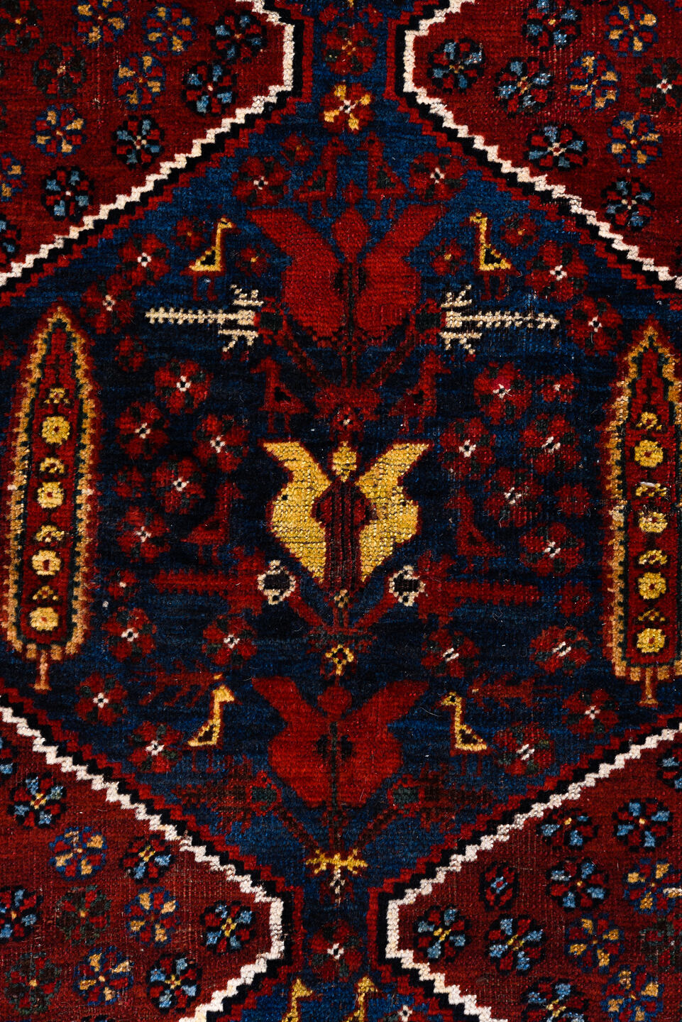5' x 8' one-of-a-kind handmade antique Qashqai medium size rug. Color palette: rust, indigo, ivory, gold, navy, brown