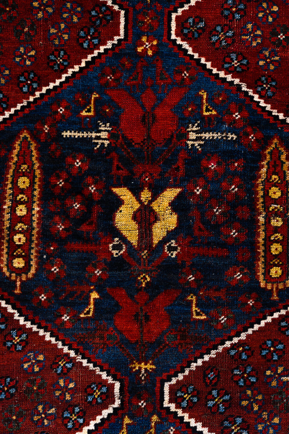 5' x 8' one-of-a-kind handmade antique Qashqai medium size rug. Color palette: rust, indigo, ivory, gold, navy, brown