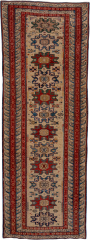 3' x 8' one-of-a-kind handmade antique Sumak runner rug. Color palette: ivory, rust, indigo, blue, gold, sage, camel
