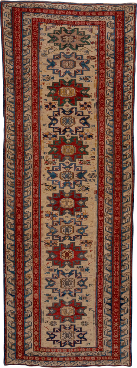3' x 8' one-of-a-kind handmade antique Sumak runner rug. Color palette: ivory, rust, indigo, blue, gold, sage, camel