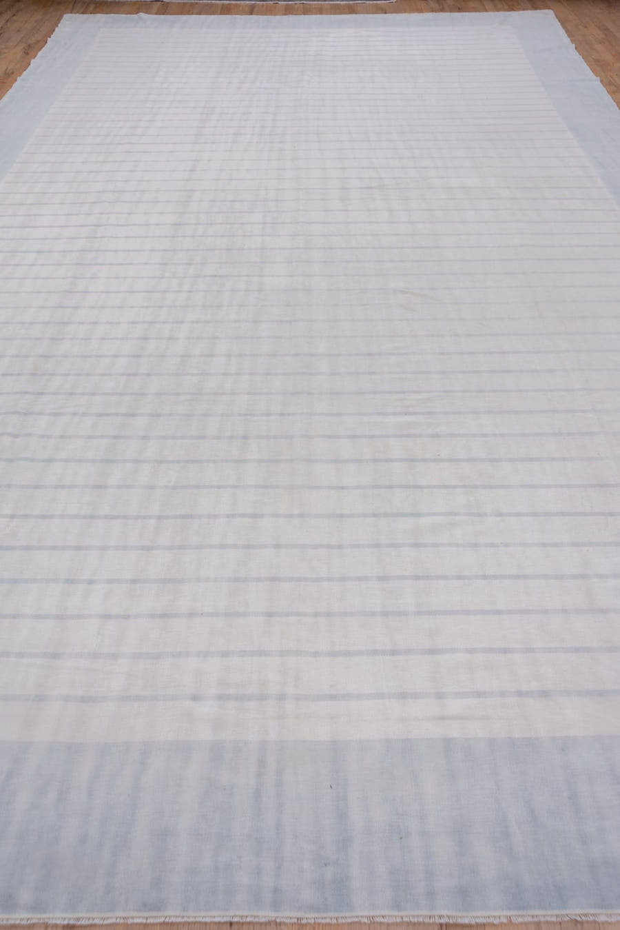 9' x 17' one-of-a-kind handmade antique Dhurrie rug. Color palette: pale blue, ivory, sky blue, light blue
