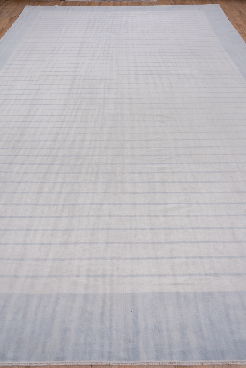 9' x 17' one-of-a-kind handmade antique Dhurrie rug. Color palette: pale blue, ivory, sky blue, light blue