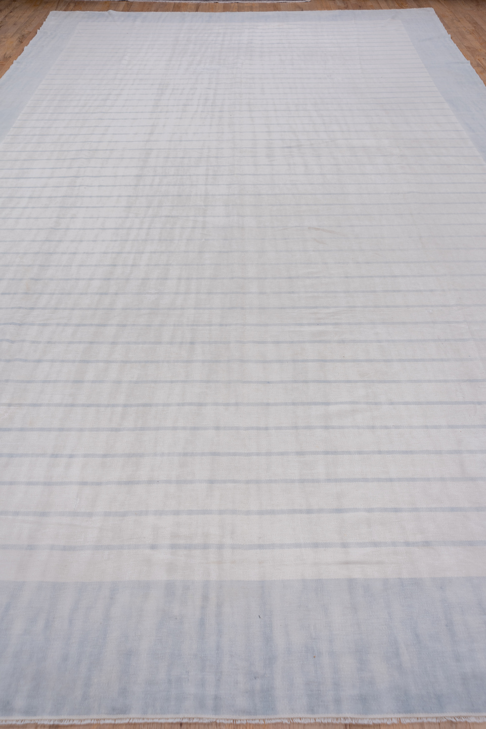 9' x 17' one-of-a-kind handmade antique Dhurrie rug. Color palette: pale blue, ivory, sky blue, light blue