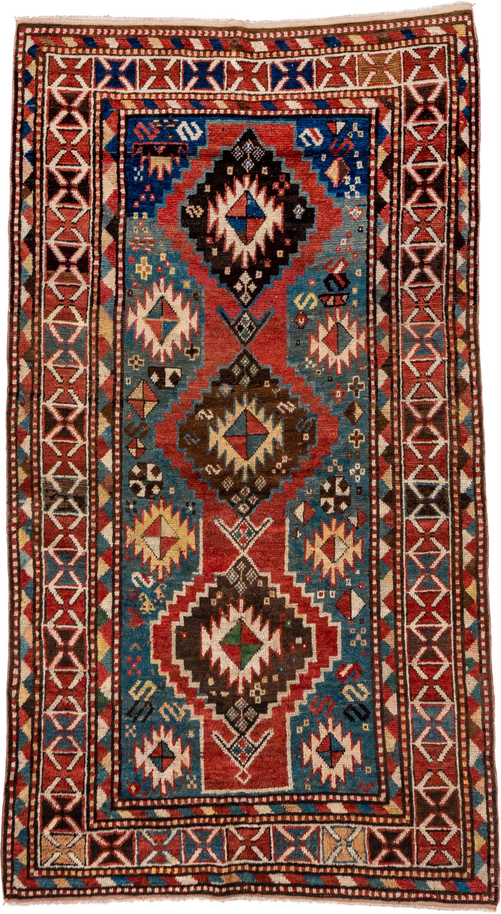 3' x 7' one-of-a-kind handmade antique Kazak rug. Color palette: rust, sky blue, ivory, navy, brown, black, camel, red