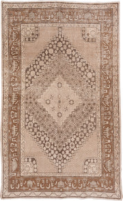 5' x 8' one-of-a-kind handmade antique Khotan medium size rug. Color palette: beige, camel, taupe, ivory, brown, gray