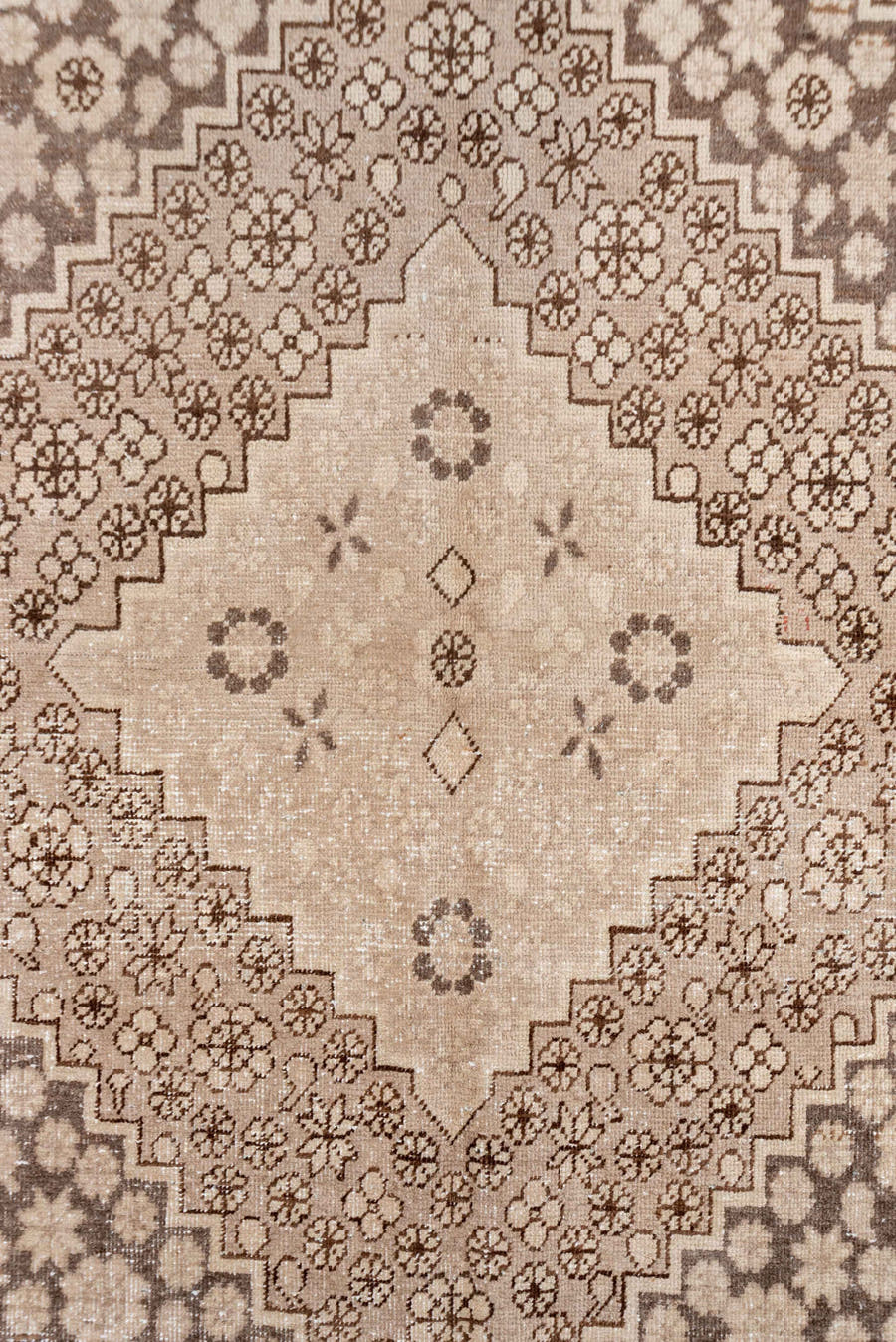 5' x 8' one-of-a-kind handmade antique Khotan medium size rug. Color palette: beige, camel, taupe, ivory, brown, gray