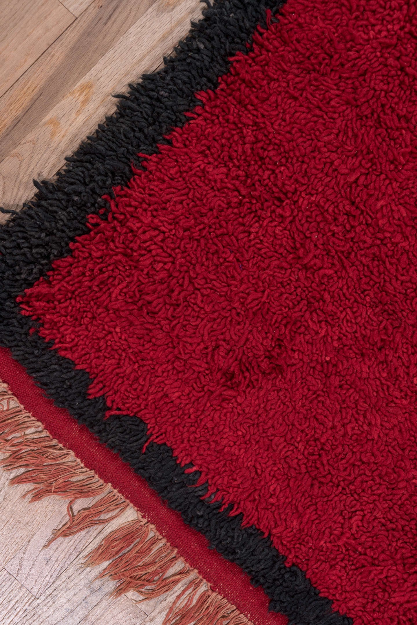 3' x 10' one-of-a-kind handmade vintage Moroccan runner rug. Color palette: crimson, black, mahogany, red, brown