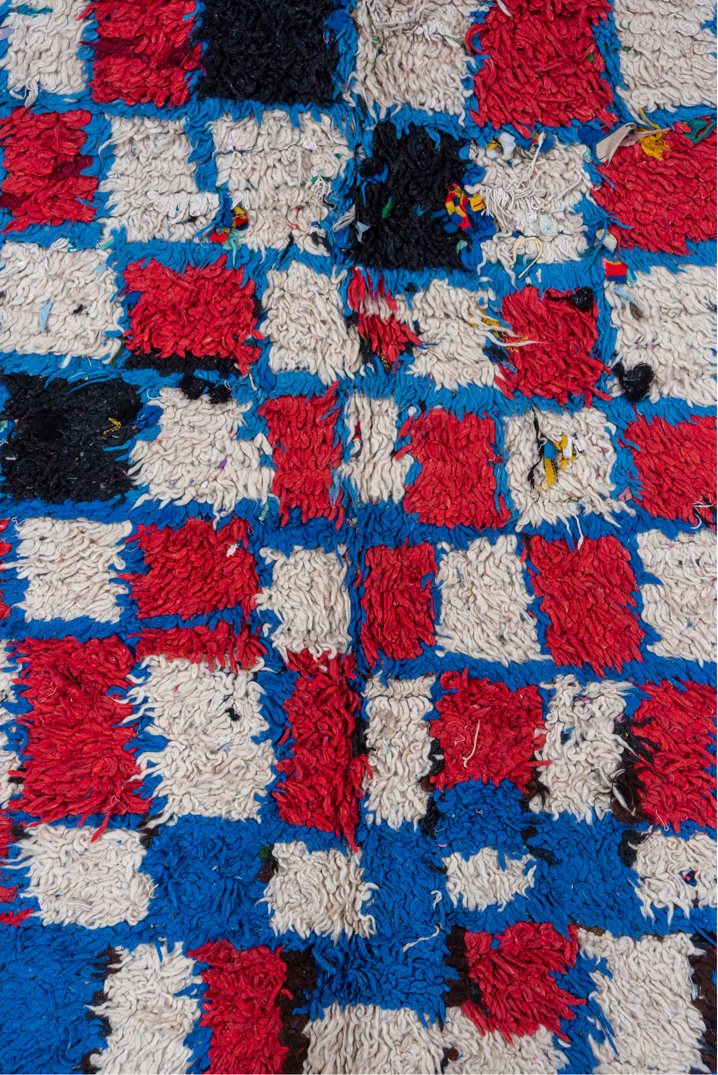 4' x 10' one-of-a-kind handmade vintage Moroccan runner rug. Color palette: black, blue, brown, charcoal, fiord, gray