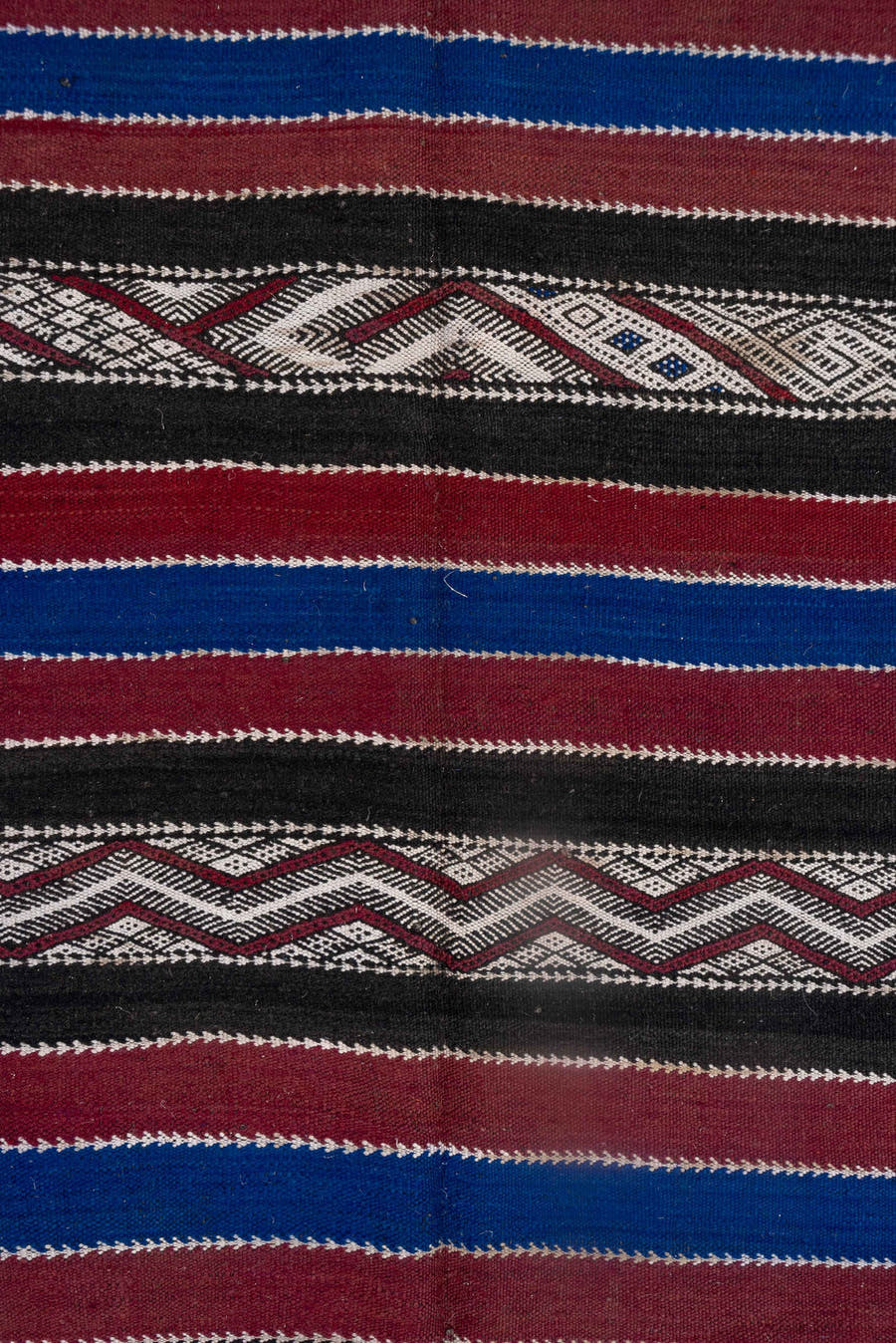 5' x 11' one-of-a-kind handmade vintage Kilim runner rug. Color palette: black, burgundy, indigo, ivory, gray, purple