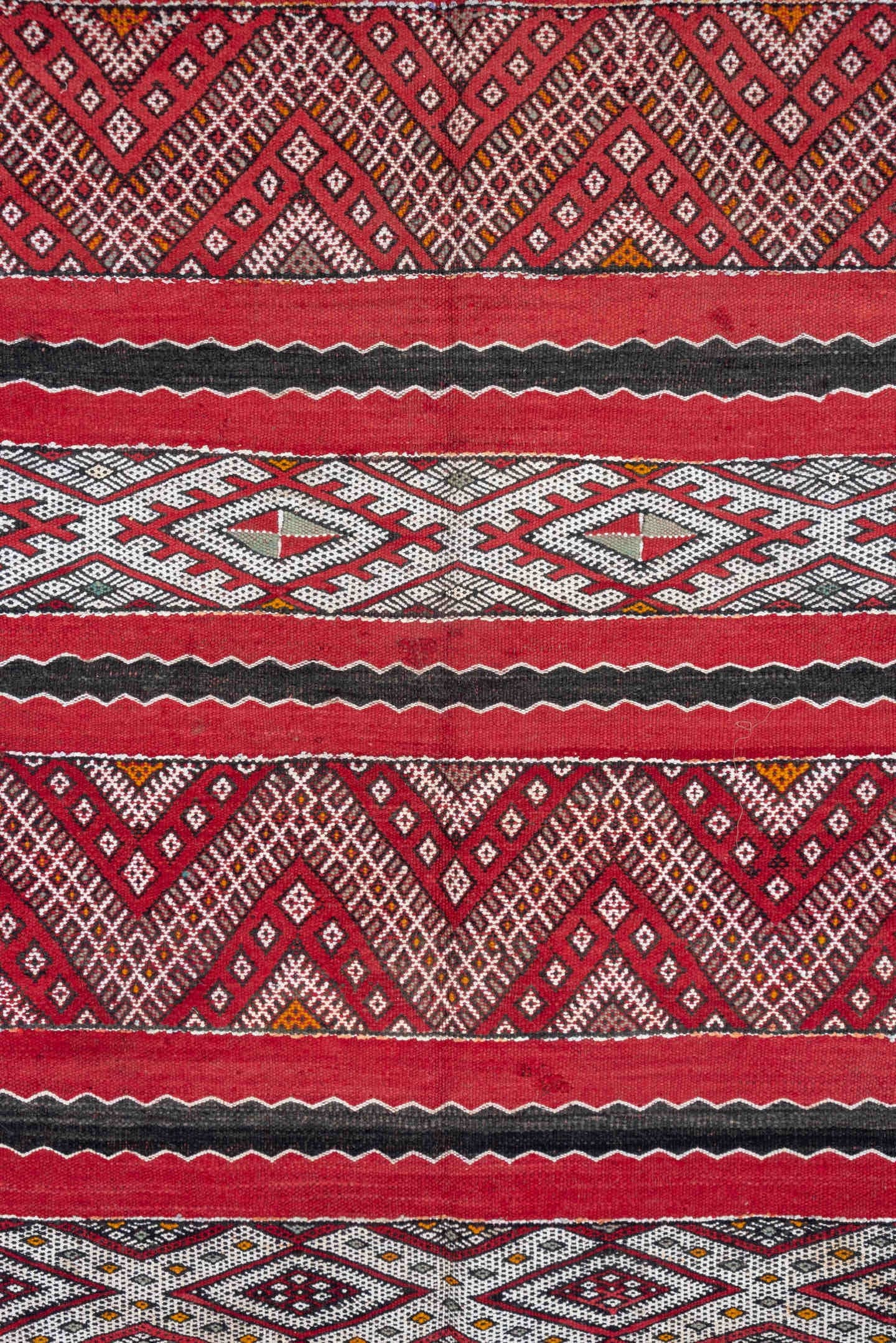 4' x 8' one-of-a-kind handmade vintage Kilim rug. Color palette: red, ivory, charcoal, rust, brown, gray, black, terracotta
