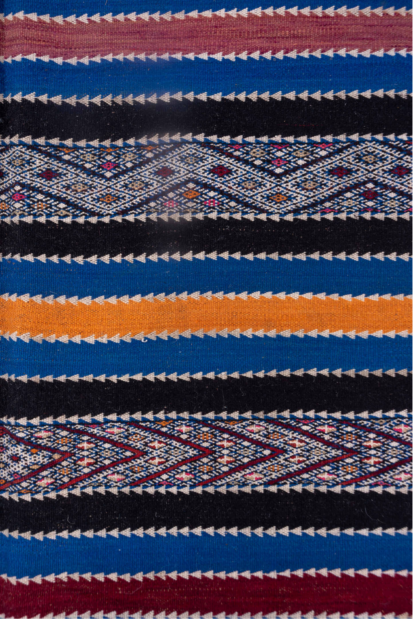 5' x 11' one-of-a-kind handmade vintage Kilim rug. Color palette: indigo, ivory, charcoal, rust, burgundy, blue, purple
