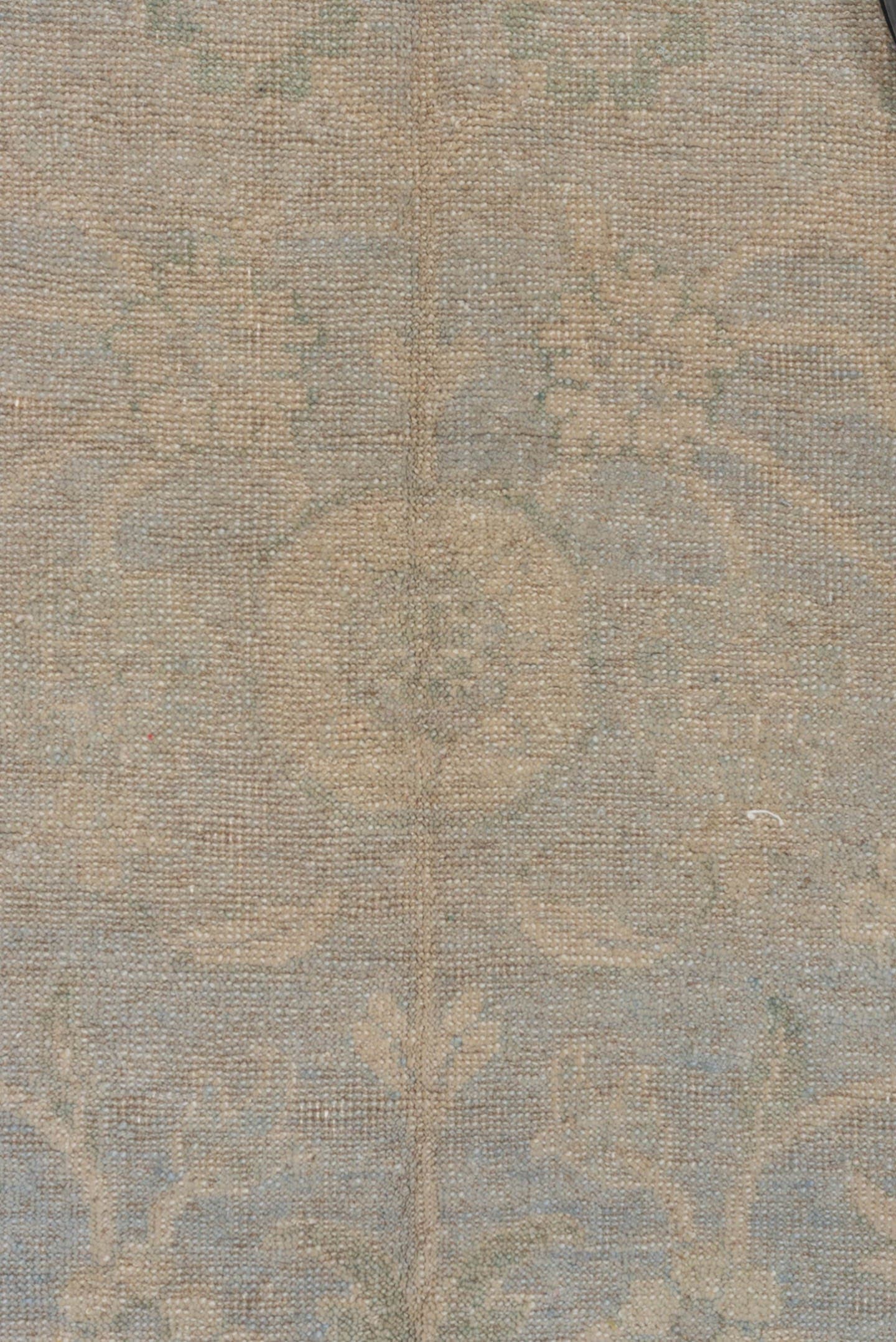 5' x 7' one-of-a-kind handmade vintage Khotan rug. Color palette: beige, ivory, pale blue, taupe, sage, light blue, gray