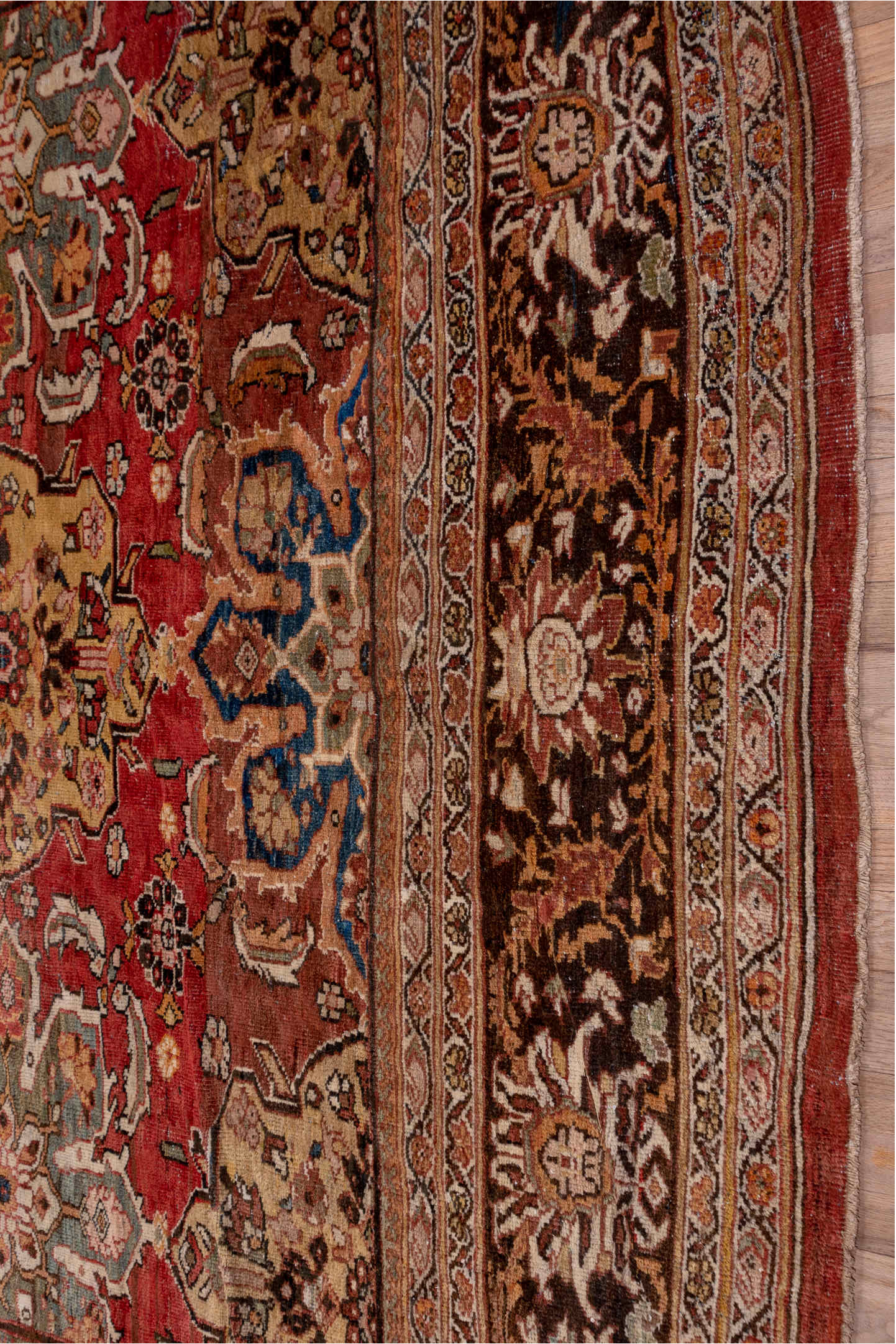 11' x 19' one-of-a-kind handmade antique Sultanabad oversize rug. Color palette: terra cotta, brown, ivory, gold, navy, sage