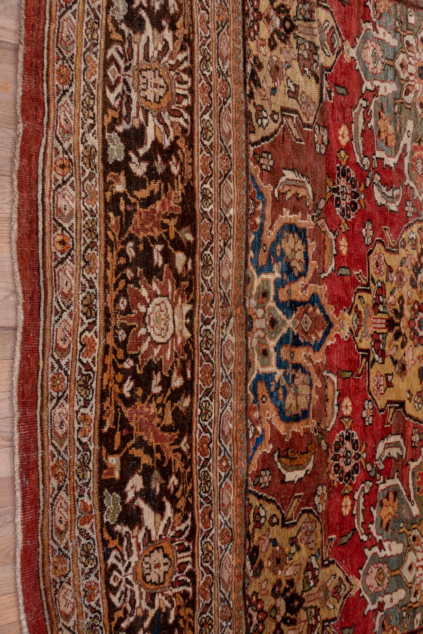 11' x 19' one-of-a-kind handmade antique Sultanabad oversize rug. Color palette: terra cotta, brown, ivory, gold, navy, sage