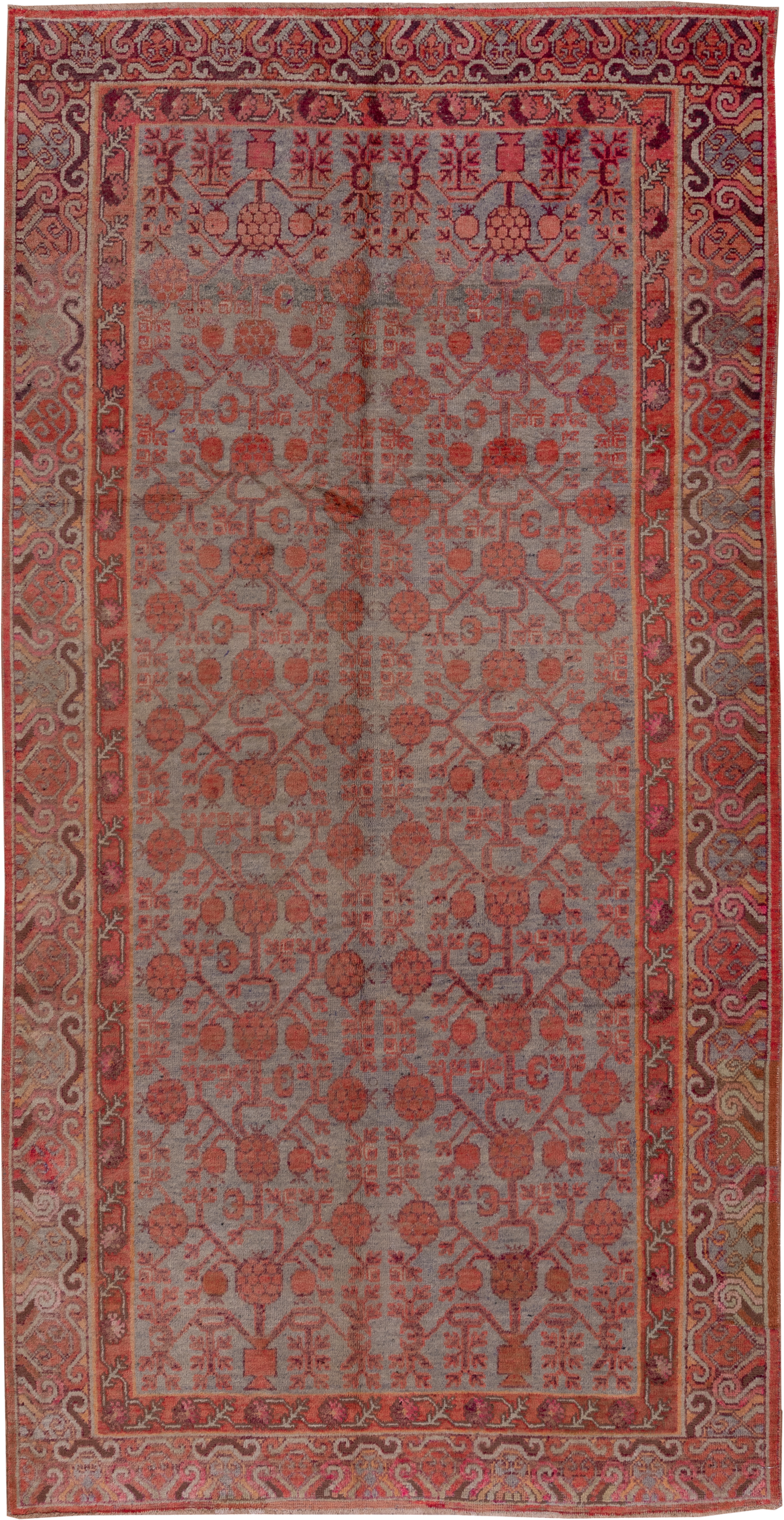 5' x 10' one-of-a-kind handmade vintage Khotan medium size rug. Color palette: rose, rust, taupe, terra cotta, dusty blue