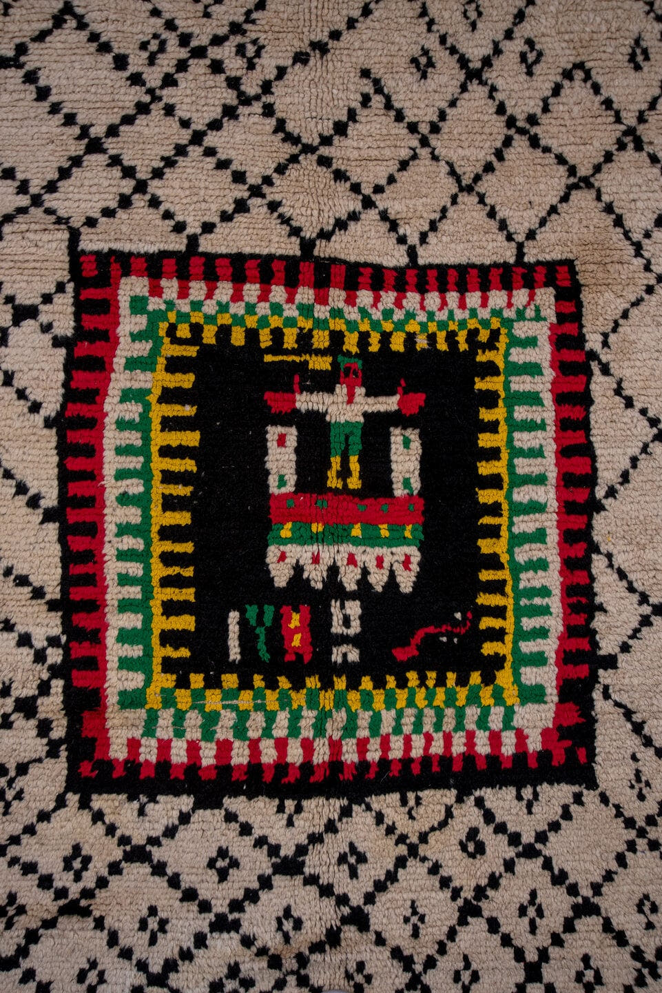 5' x 7' one-of-a-kind handmade antique Moroccan rug. Color palette: ivory, black, crimson, green, gold, rose, red, pink
