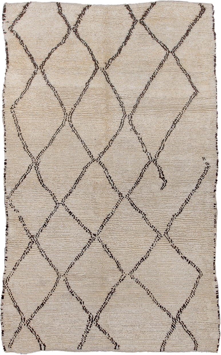 5' x 9' one-of-a-kind handmade antique Moroccan medium size rug. Color palette: ivory, brown, cream