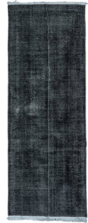 4' x 11' one-of-a-kind handmade vintage Overdyed runner rug. Color palette: charcoal, slate, ivory, gray, black
