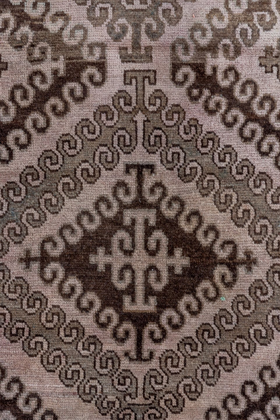 5' x 8' one-of-a-kind handmade antique Belouch medium size rug. Color palette: taupe, brown, charcoal, rose, rust, ivory