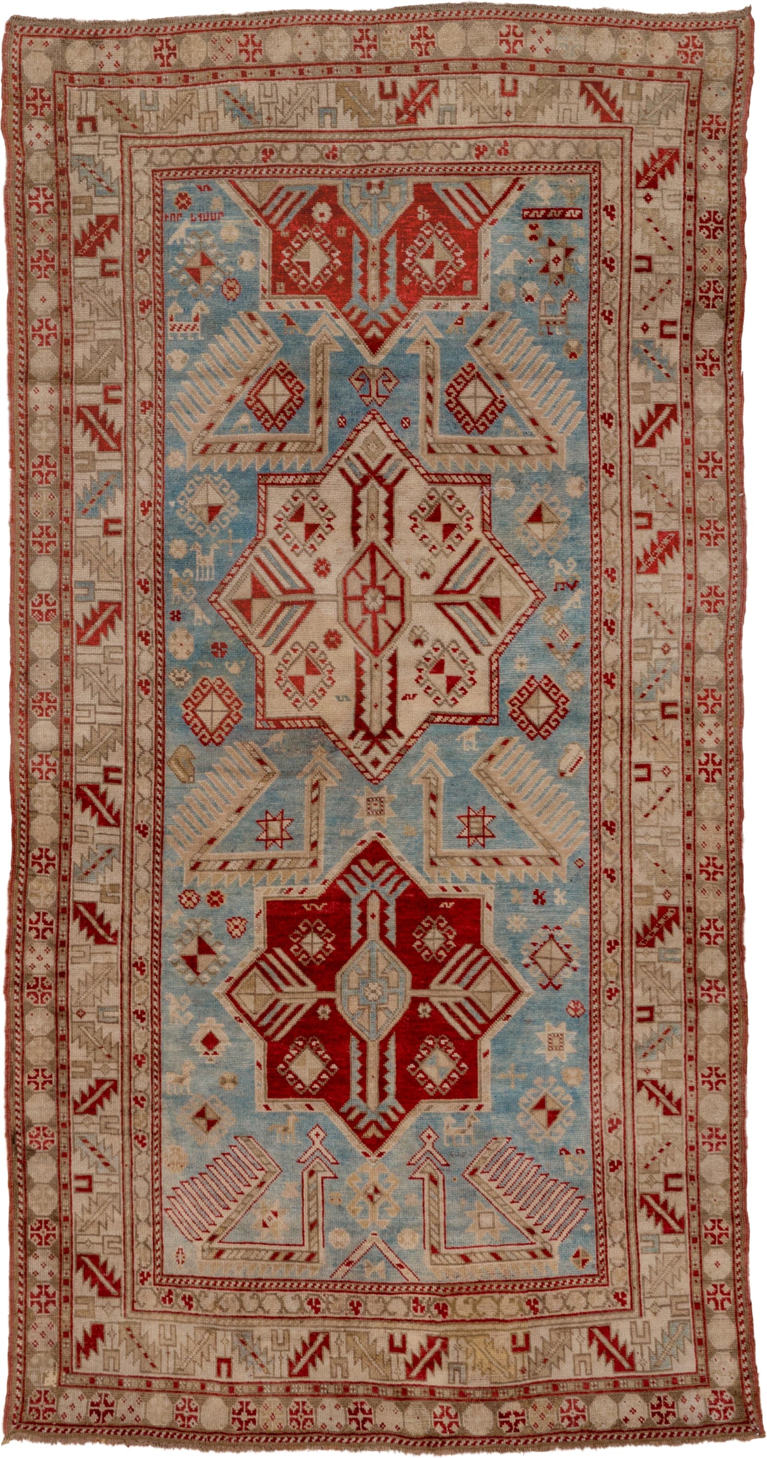 3' x 7' one-of-a-kind handmade antique Caucasian runner rug. Color palette: ivory, sky blue, rust, beige, camel, crimson