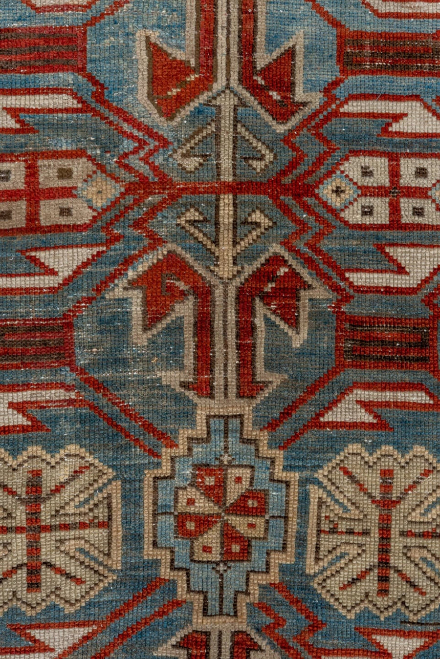 5' x 9' one-of-a-kind handmade antique Caucasian medium size rug. Color palette: light blue, ivory, rust, red, slate, camel