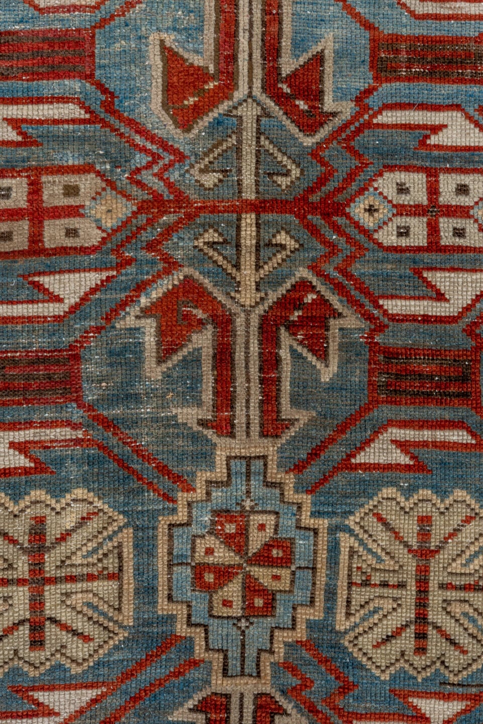5' x 9' one-of-a-kind handmade antique Caucasian medium size rug. Color palette: light blue, ivory, rust, red, slate, camel