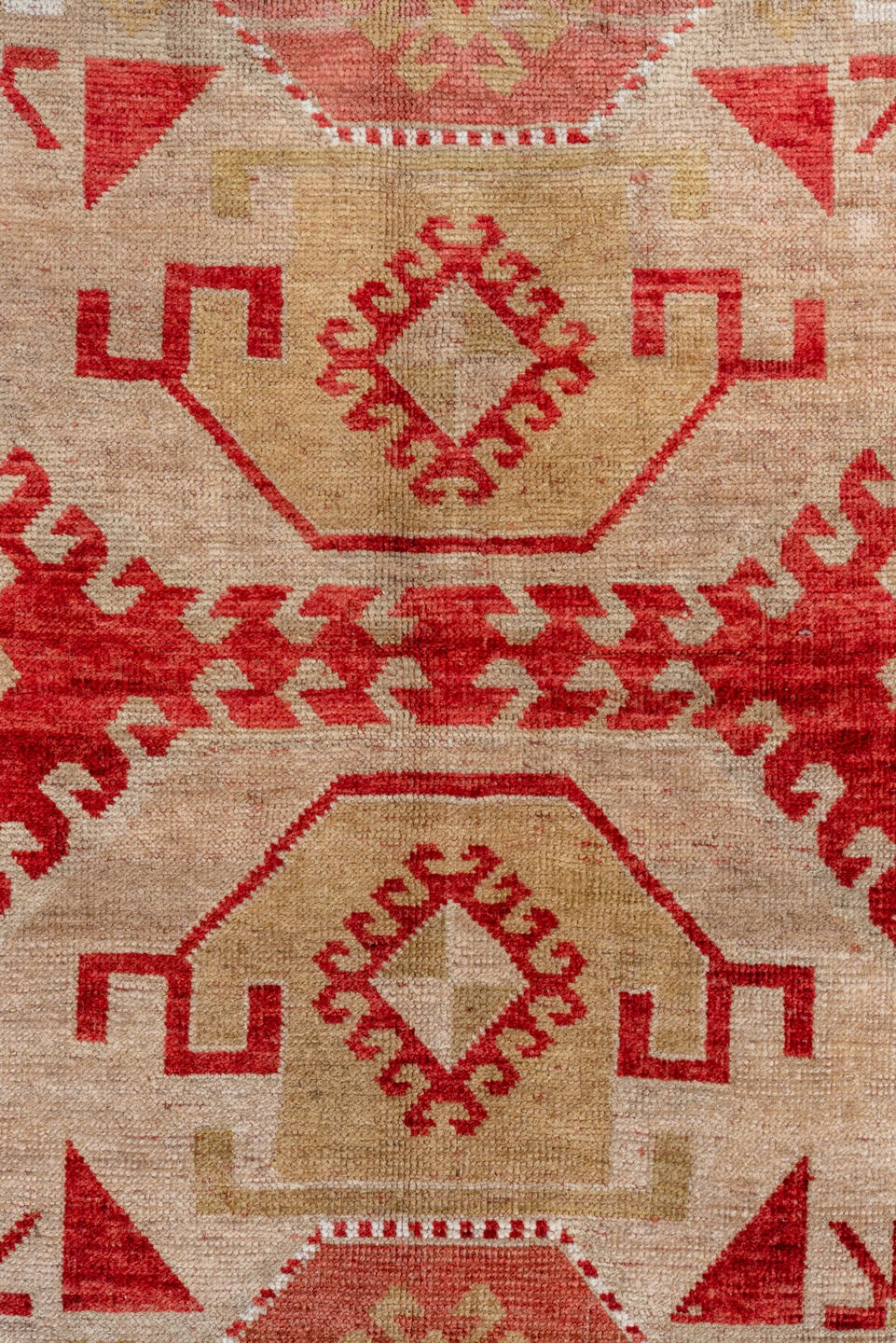 4' x 7' one-of-a-kind handmade antique Caucasian rug. Color palette: rust, ivory, camel, rose, terra cotta, terracotta