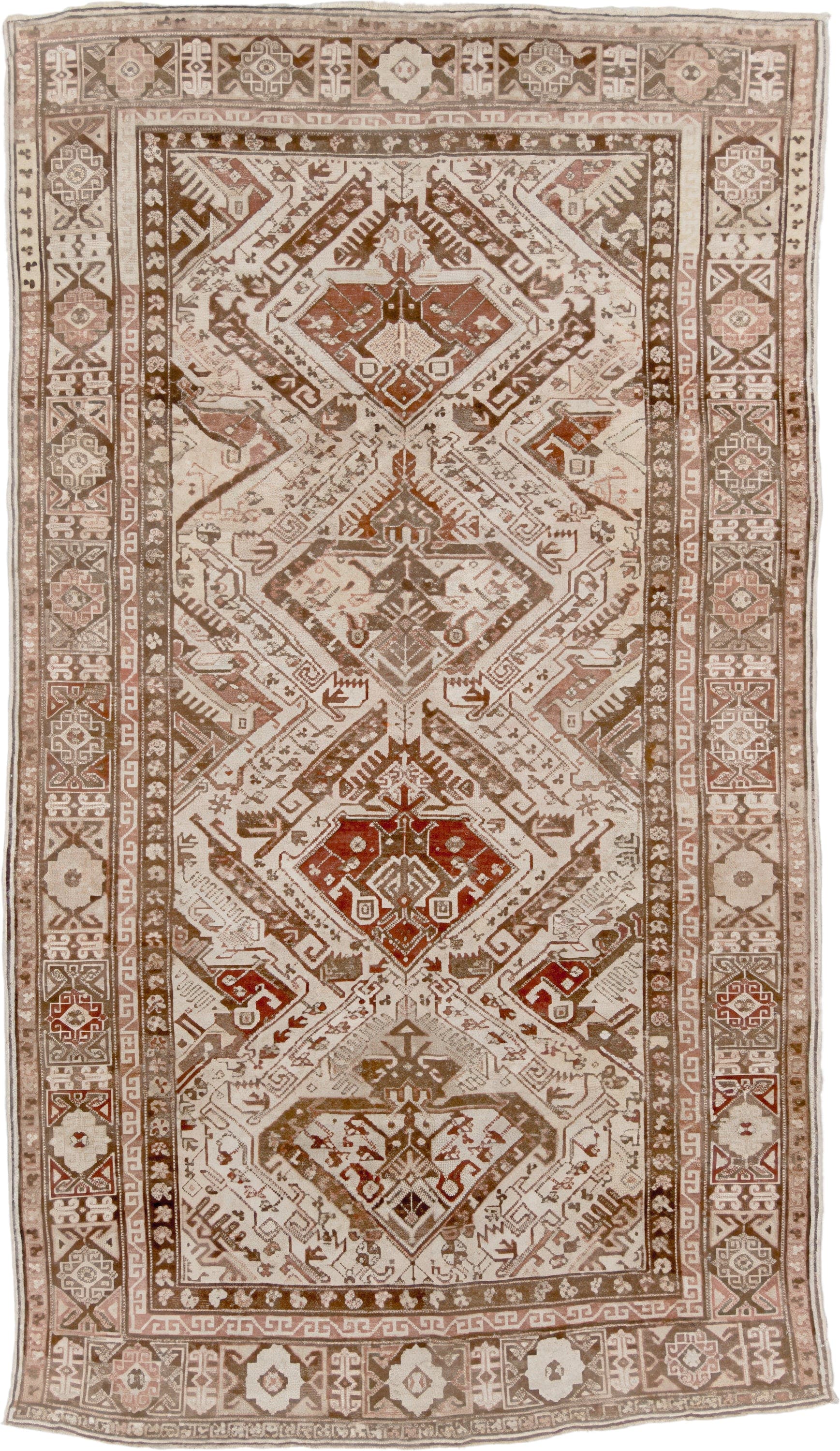 5' x 10' one-of-a-kind handmade vintage Caucasian medium size rug. Color palette: ivory, taupe, brown, rust, camel, rose