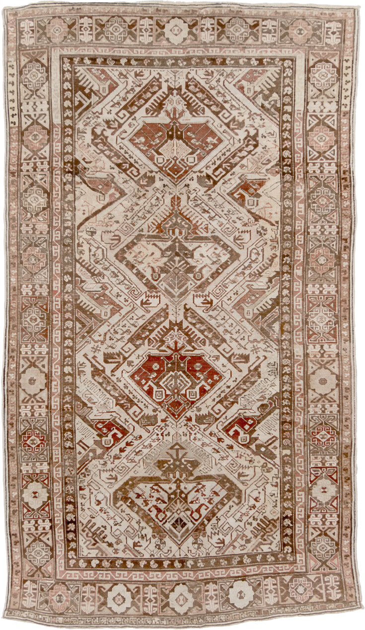 5' x 10' one-of-a-kind handmade vintage Caucasian medium size rug. Color palette: ivory, taupe, brown, rust, camel, rose