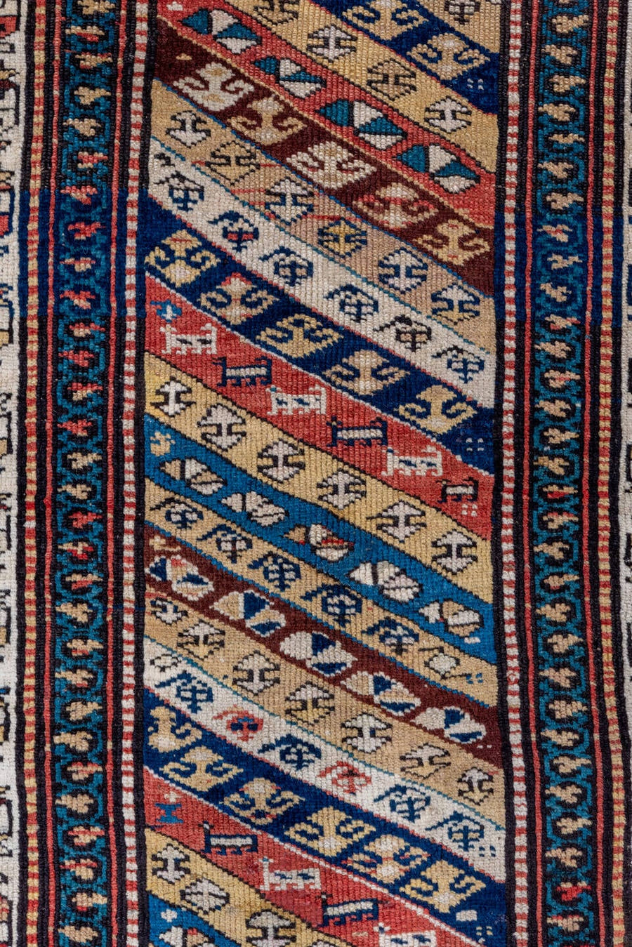 2' x 5' one-of-a-kind handmade antique Caucasian small size rug. Color palette: ivory, navy, rust, sky blue, brown, red