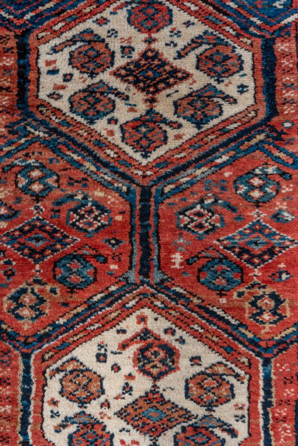 3' x 9' one-of-a-kind handmade antique NW Persian runner rug. Color palette: rust, indigo, ivory, navy, terra cotta, camel