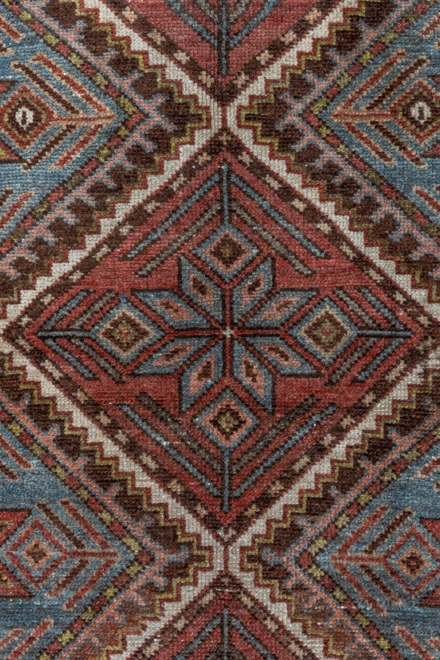 5' x 10' one-of-a-kind handmade antique Baktiary medium size rug. Color palette: rust, ivory, sky blue, brown, burgundy