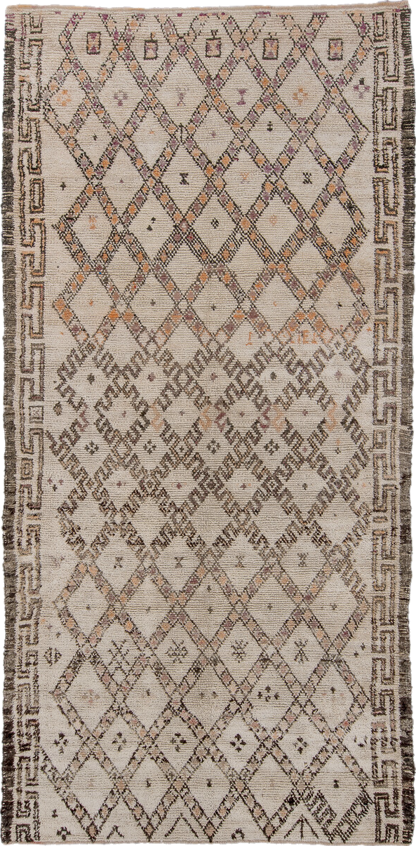 5' x 11' one-of-a-kind handmade vintage Moroccan rug. Color palette: black, brown, gray, light gray, off-white, pink, snow