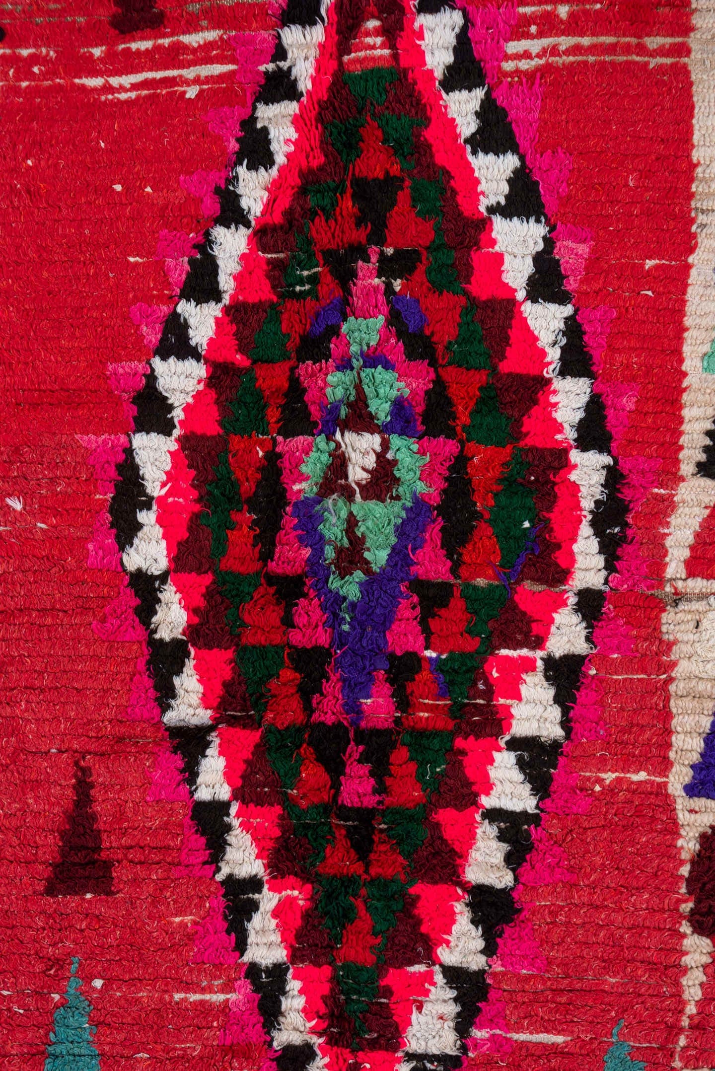 4' x 5' one-of-a-kind handmade vintage Moroccan small size rug. Color palette: red, ivory, black, fuchsia, turquoise