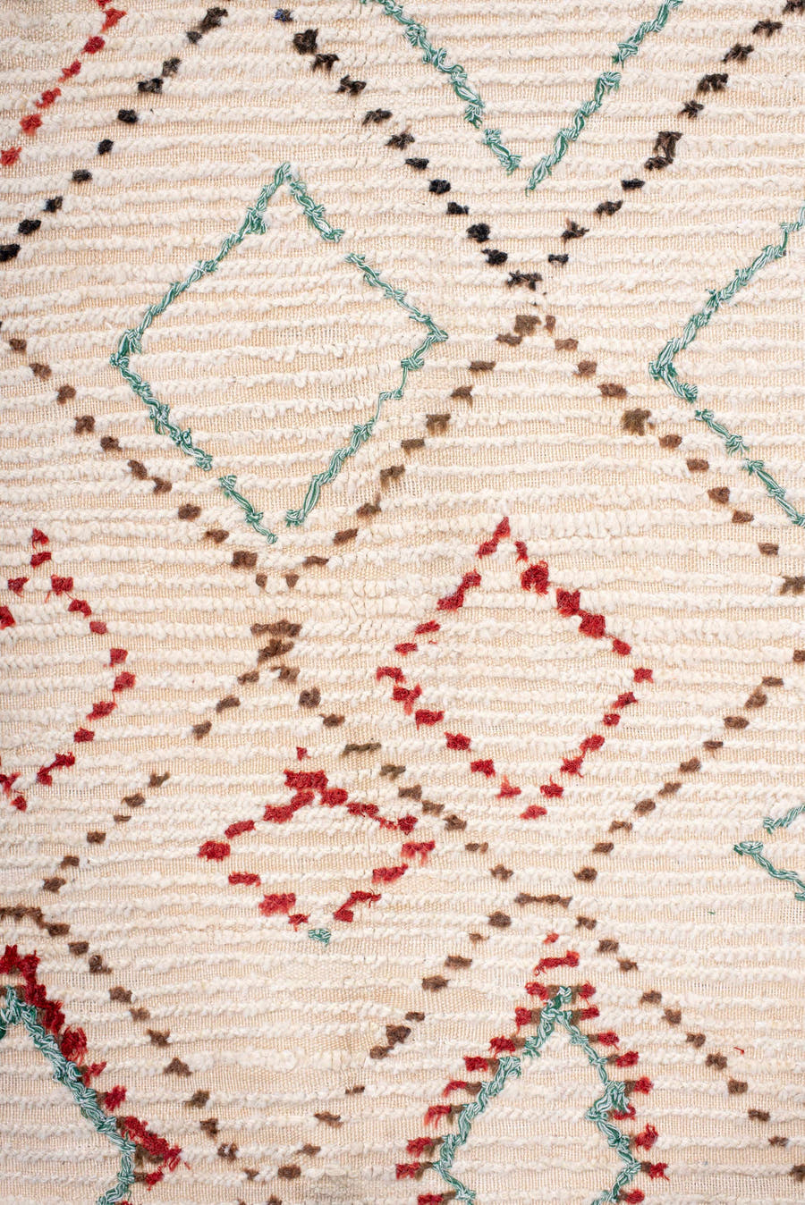5' x 10' one-of-a-kind handmade vintage Moroccan medium size rug. Color palette: ivory, brown, red, aqua, cream, teal